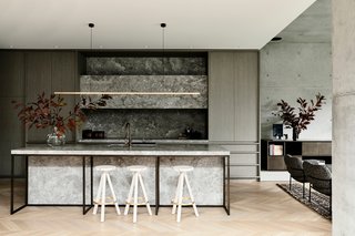 "A narrative unfolds of stunning detail and tactile material of raw steel, dark paneled walls, concrete, bronze, timber and stone—elements that invite you to touch and feel," says Bear.