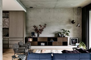The open-plan living room connects to the kitchen and outdoors.