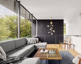 Wrapped in frameless glass set atop a continuous planter wall, the upper level looks out to the trees and beyond. 