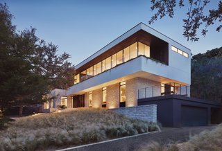 Huge, frameless glass windows have been used for the new upper level. 