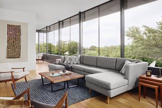"Large overhangs provide shade at all times of the day, and the surrounding cladding of charred cypress prevents glare and adds a textural counterpoint," says Specht.