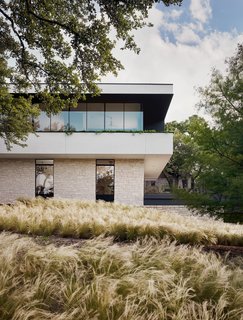  A garage and gym are contained within the lowest level of the house. 