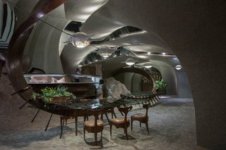 Every interior surface was crafted, inlaid, or textured with natural materials such as steel, mahogany, or glass tiles. 