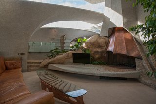 Within, the curving interiors are spread loosely across five levels. 
