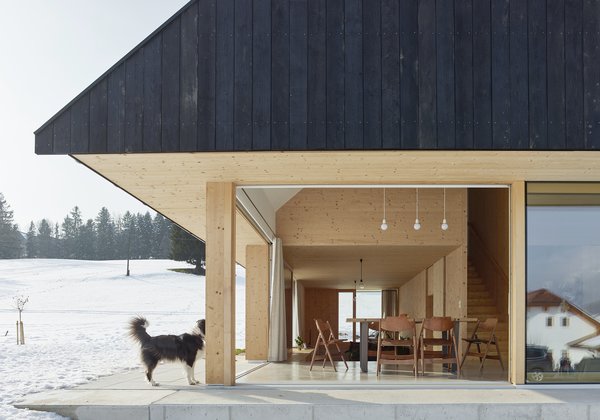 The house’s distinguishing feature is its oversized gable roof that has a simple circle in the middle to bring in more light.