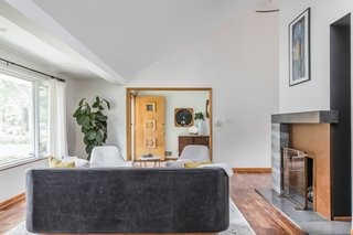 The new eight-foot tall chimney. Though the cutout was never a part of their original plan, they now love this unique feature, as it brings ample light into the dining room. 