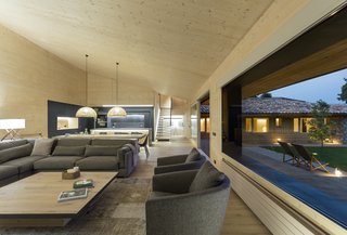 Large expanses of glazing visually connect the living room with the garden.