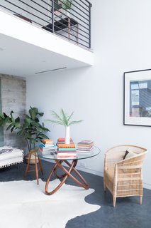 An entrance lounge and concealed laundry are located on the entrance level, where there is also a small lounge area with books.