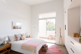 Three bedrooms and bathrooms with generous, tapered ceilings reside on the third level. 