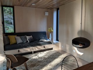 A hanging fireplace in Madrona brings warmth while staying compact.