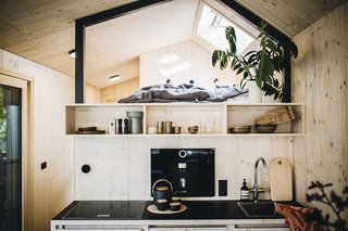 A built-in coffee machine in the kitchenette.