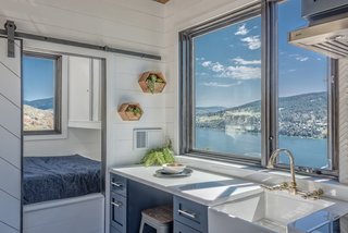 Benjamin Moore Hale Navy paint was used for the cabinets, which were fitted with brass handles.