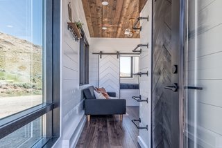 Stained wood and plenty of large windows give the interiors a warm, bright, and cozy feel.