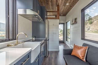 The kitchen cabinetry was created to be much shallower then average cabinets to allow for more floor space. More so, the fridge is skinner yet taller than other models.