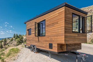 The exterior is clad in a mixture of stained cedar and shou sugi ban siding.