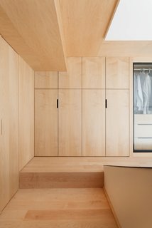 The discreet wooden closet matches the flooring.
