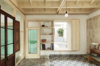 Light from outdoors streams into one of the atmospheric interior spaces.
