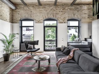 Buble Blob sofa, Duke coffee table, and black leather Pelle Plus chair by Arketipo.