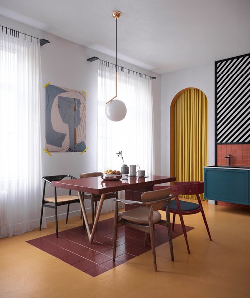In the dining area sits Finn Juhl 109 chairs, a bespoke table, as well as a chandelier from Flos. There is also a Le Corbusier painting on the wall.
