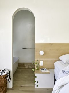 Smaller barrel vaults in the master bedroom create uniformity between the interlocking volumes. 