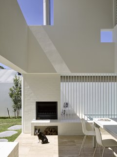 A double-height Outdoor Room provides opportunities for al fresco living all year long. 