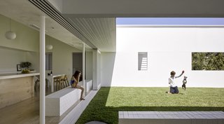 Direct connections from the interior to the courtyard allow the parents to keep and eye on their children as they peacefully play. 