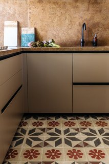 In the kitchen the designers paired ancient Sicilian decorated tiles with a refreshed, modern layout. 