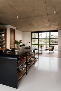 The industrial use of building materials continues to the interior closets, cupboards, and kitchen area. 