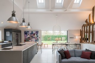 The kitchen features new skylights and a large window in the north elevation to improve light flow into the lofty interiors.