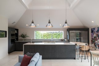 A streamlined, modern kitchen with shiplap joinery.