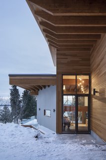 A floor-to-ceiling glass entrance door.