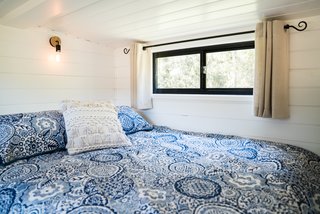 This sleeping loft has a queen-sized mattress with plenty of headroom for reading in bed. 