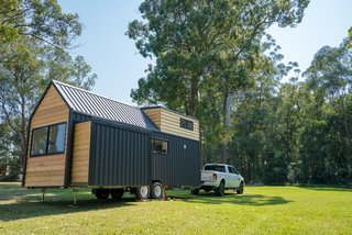 The trailer is set on wheels, so the home is easily relocatable, and can be registered as a caravan. A power drill winds the slide-out inward and outward.