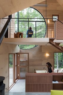 A dining area on the lower level, and a study on the upper level.