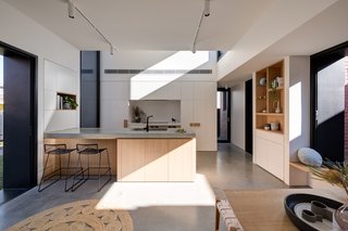 The floors in the extension are hydronic-heated, polished concrete.