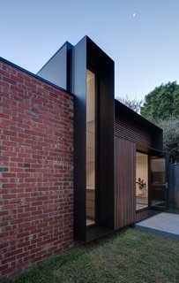 Recycled red bricks are used for sections of the exterior walls.