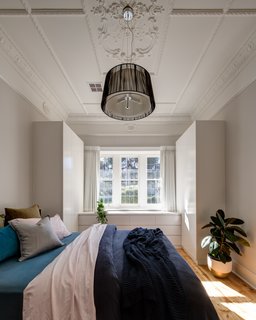 The stucco ceiling in the bedroom was restored.