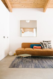 A CB2 "Lawndale" daybed, and carpet from Serena and Lily.