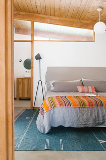 A Duxiana king-sized platform bed and a Mañana lamp in the master bedroom.