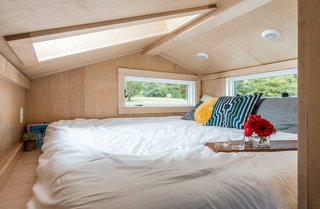 A king-sized bed fits snugly in the loft.