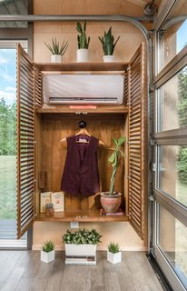 The air conditioning unit is concealed within a closet.