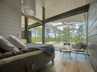 The master bedroom enjoys lake views.