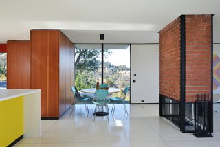The renovation restored the original brick and steel fireplace.
