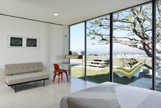 A bedroom that looks out to the pool.
