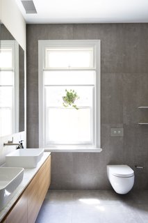 The bathroom is sleek and understated.