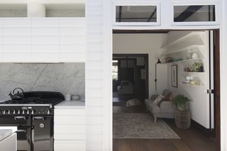 The kitchen in the new extension flows into the living lounge in the original house.