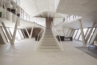 The ceiling is made from wooden planks painted white. 