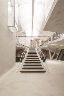 Smoothed and waxed concrete shapes the interior. 