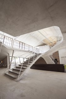 The loft is illuminated by Molto Luce Spots Turn On 110 lighting.