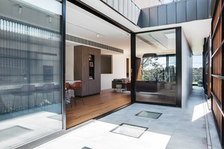 Venture Plank engineered timber flooring in the Oak Quantum finish run throughout the home. 